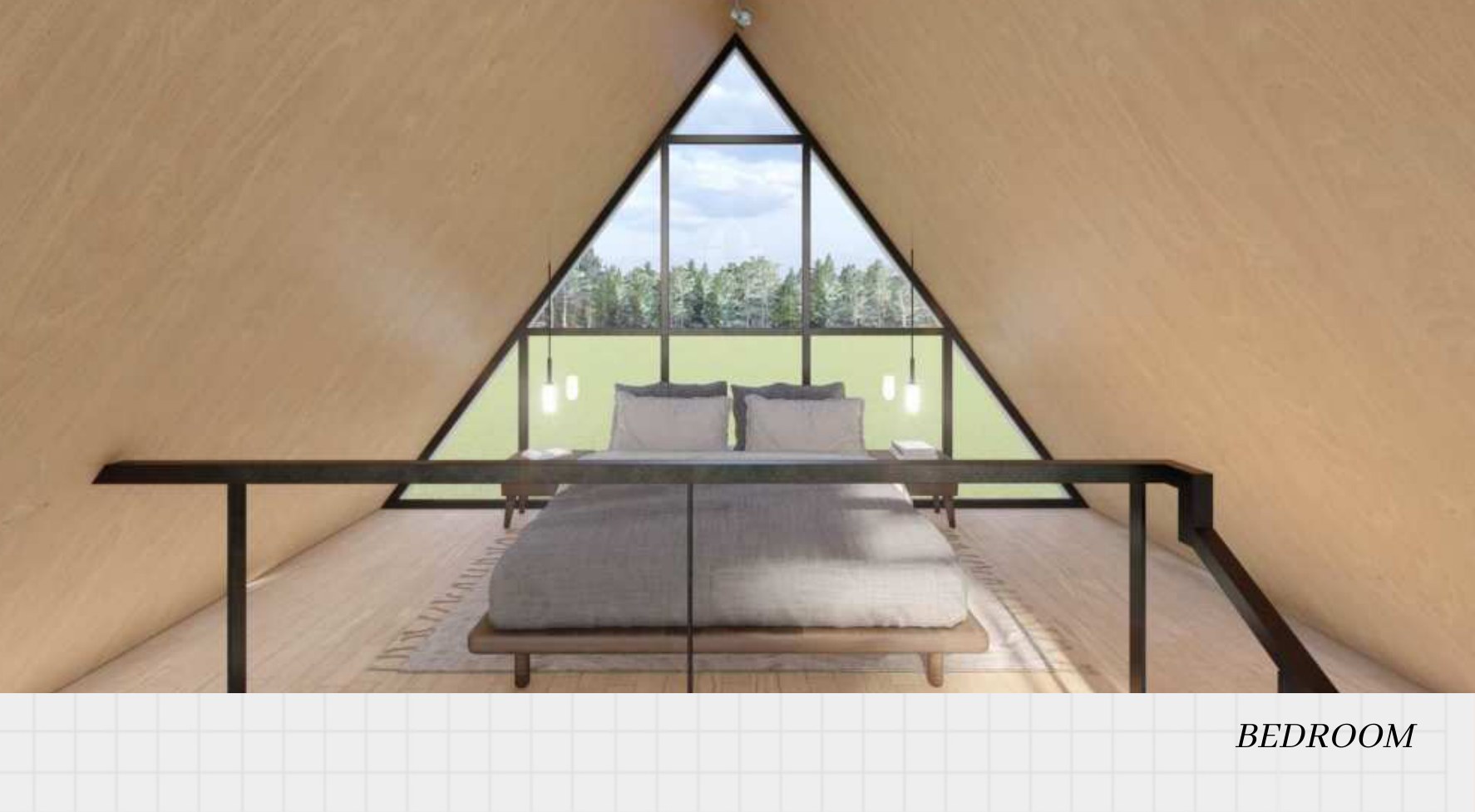 Loft bedroom framed by the A-frame glazing and forest view